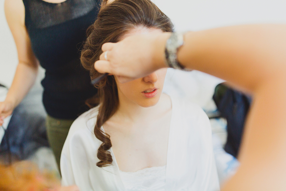 Santorini bride preparation with makeup artist