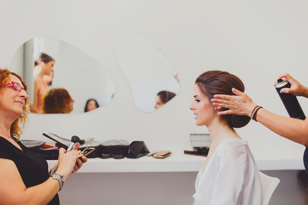 Santorini bride preparation with makeup artist