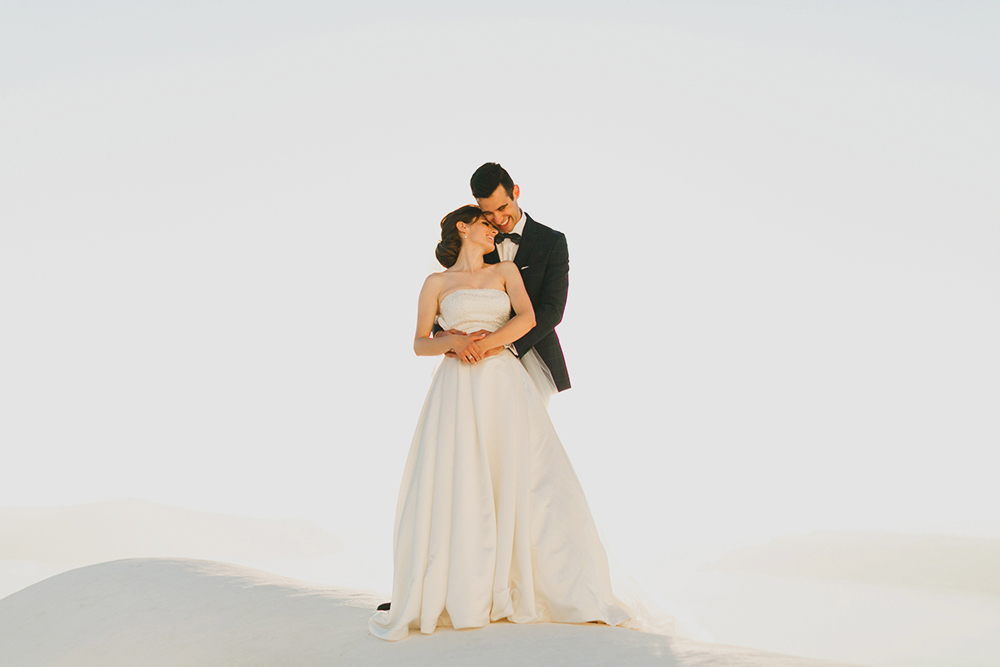Santorini Imerovigli wedding photoshoot of bride and groom in happy love moments