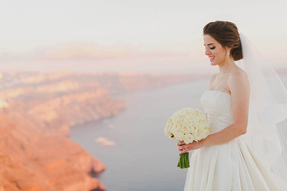 Santorini Imerovigli wedding photoshoot of bride and groom in happy love moments