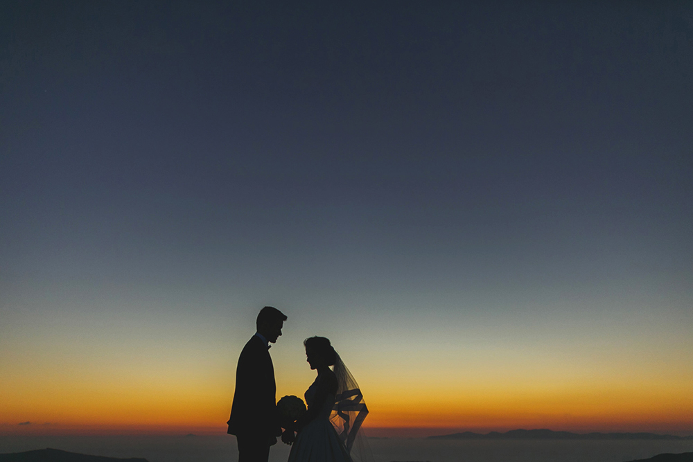 Santorini Imerovigli wedding photoshoot of bride and groom in happy love moments